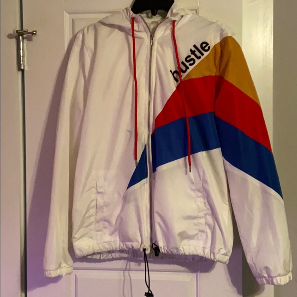 white “hustle” bomber jacket
